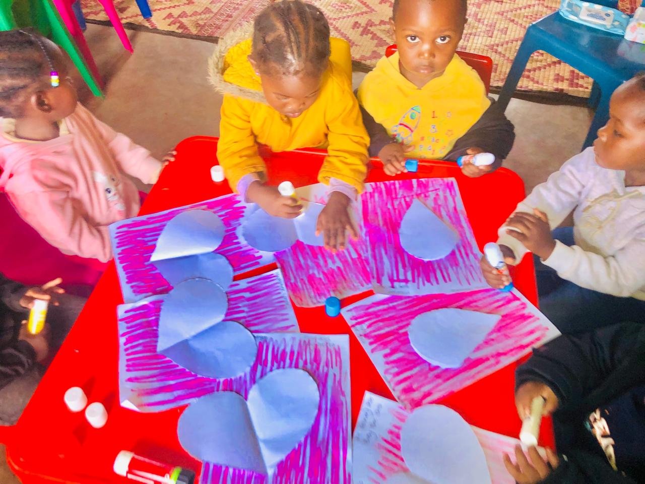 Children completing a colourful classroom art activity