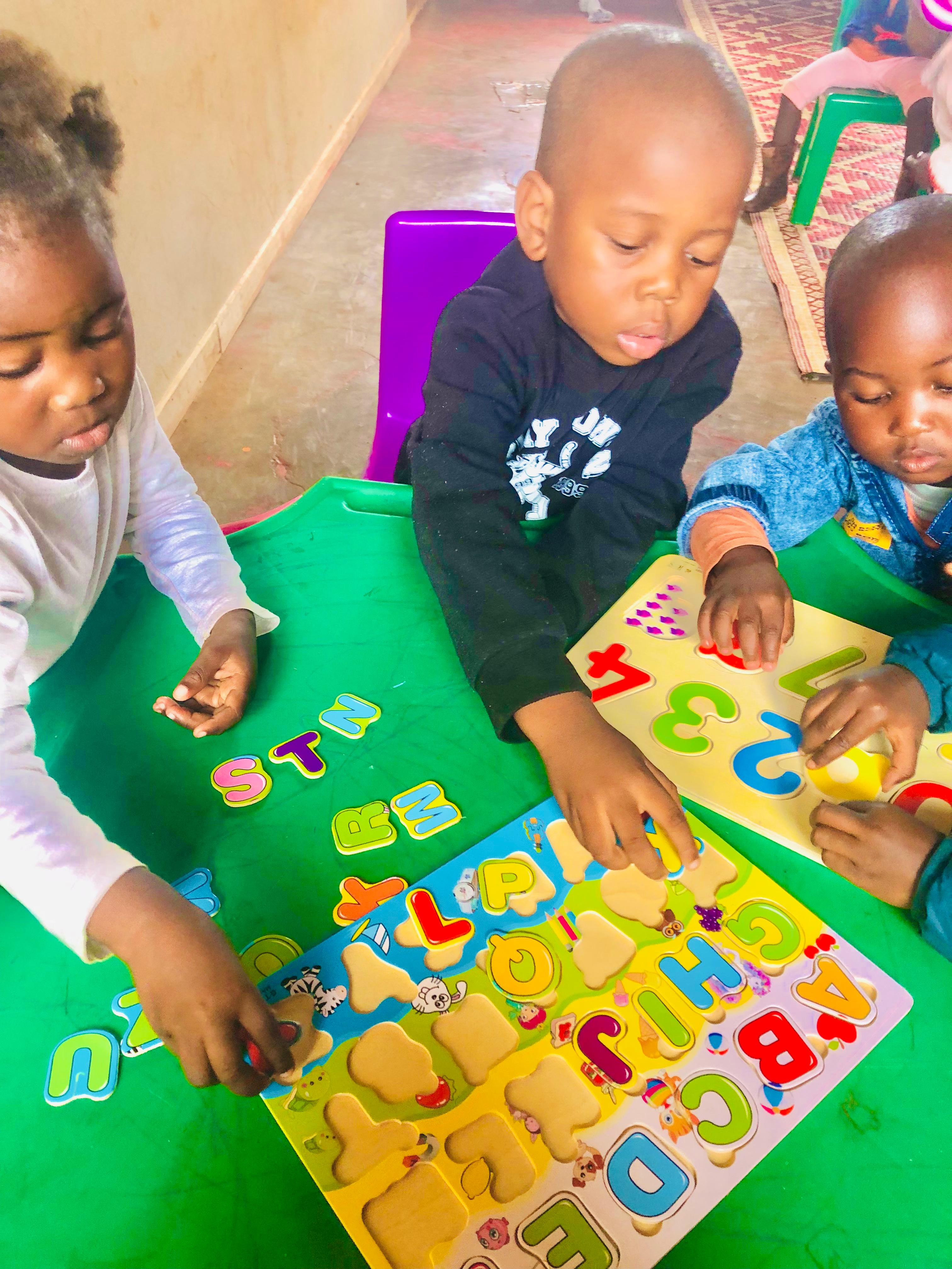 A child enjoying a day care learning activity
